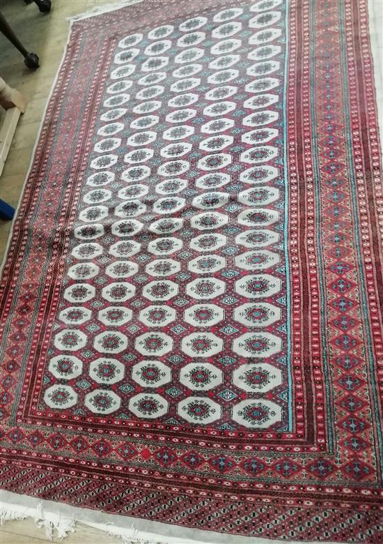 A Pakistan Bokhara rug, woven with rows of elephant foot Motifs 275 x 188cm